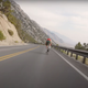 A screenshot from a video of someone riding down a hill on a bike. The speed in the corner reads 41mph.